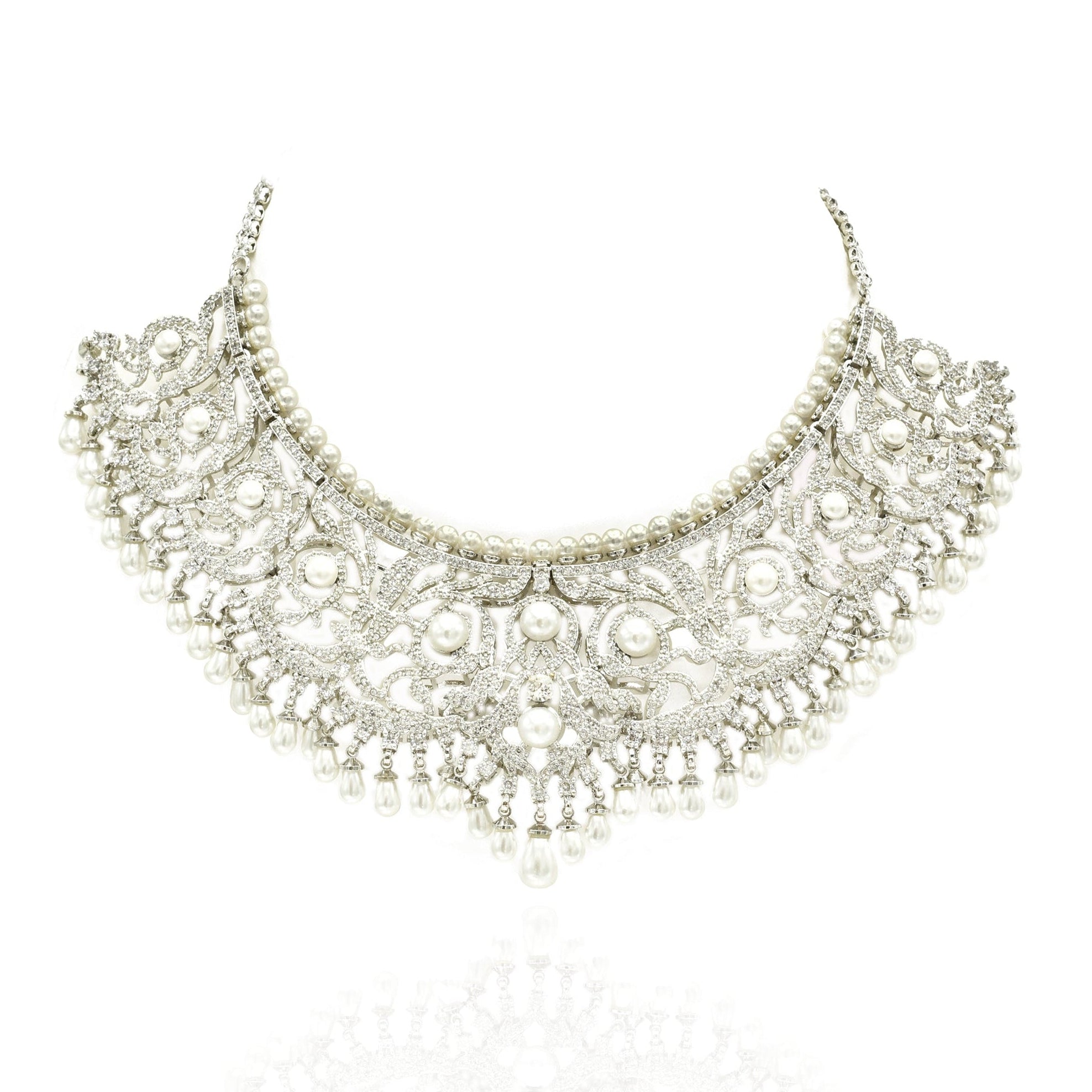 Silver-tone American Diamond choker necklace set with intricate floral detailing, white pearl accents, cascading pearl drops and matching earrings.