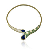 Contemporary gold-tone Hasli necklace set with deep blue teardrop stones, green pavé-style detailing, Kundan-inspired accents and matching long earrings.