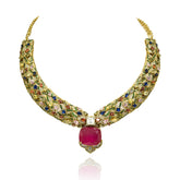 Gold-tone multicolor statement necklace set with intricate jewel-tone stones, bold deep pink center stone and matching pink statement earrings.