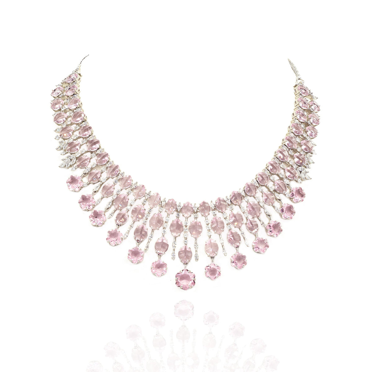 Elegant pink American diamond necklace set with matching long earrings featuring blush pink stones, floral drop accents, and a rhodium-plated finish for bridal and festive wear.