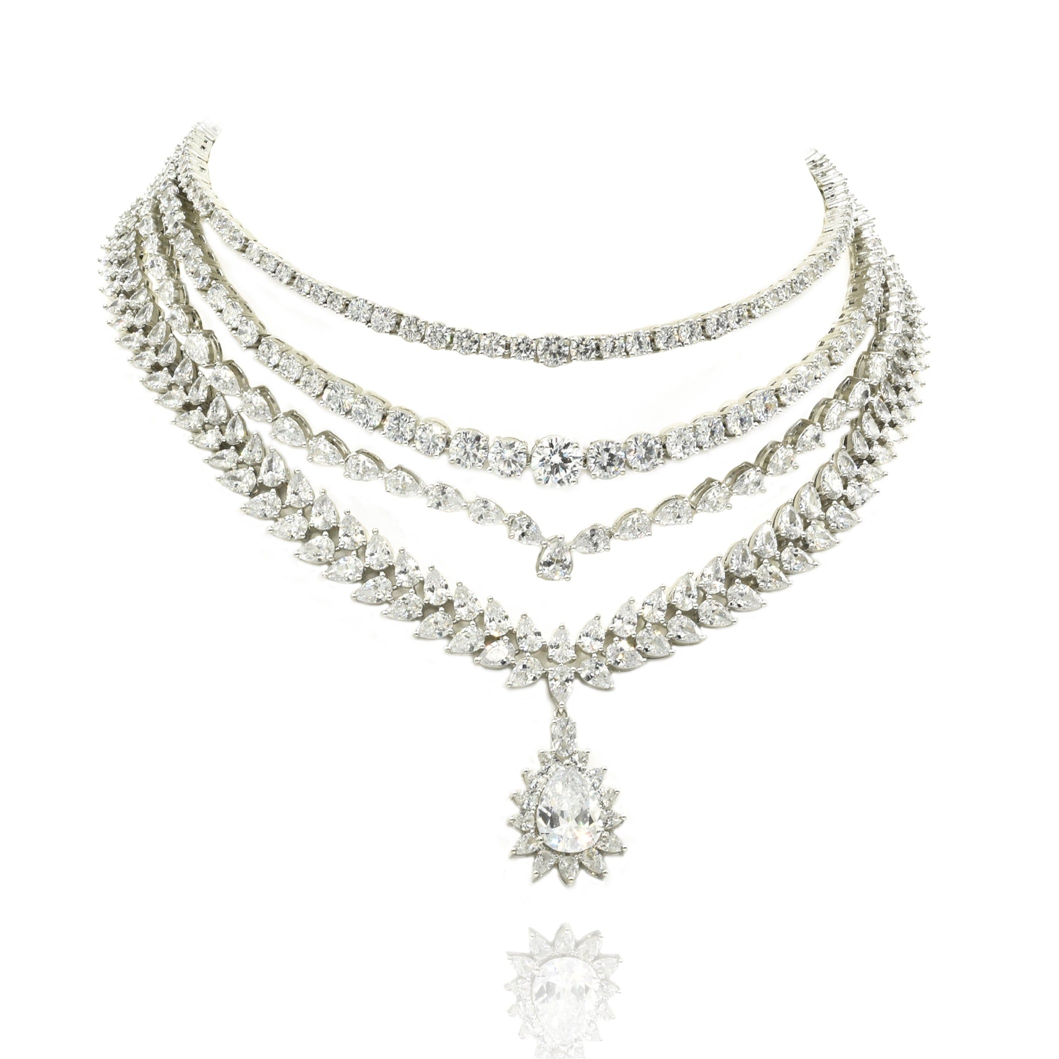 Four-layer American Diamond necklace set with clear CZ stones, teardrop starburst centerpiece and matching long statement earrings.