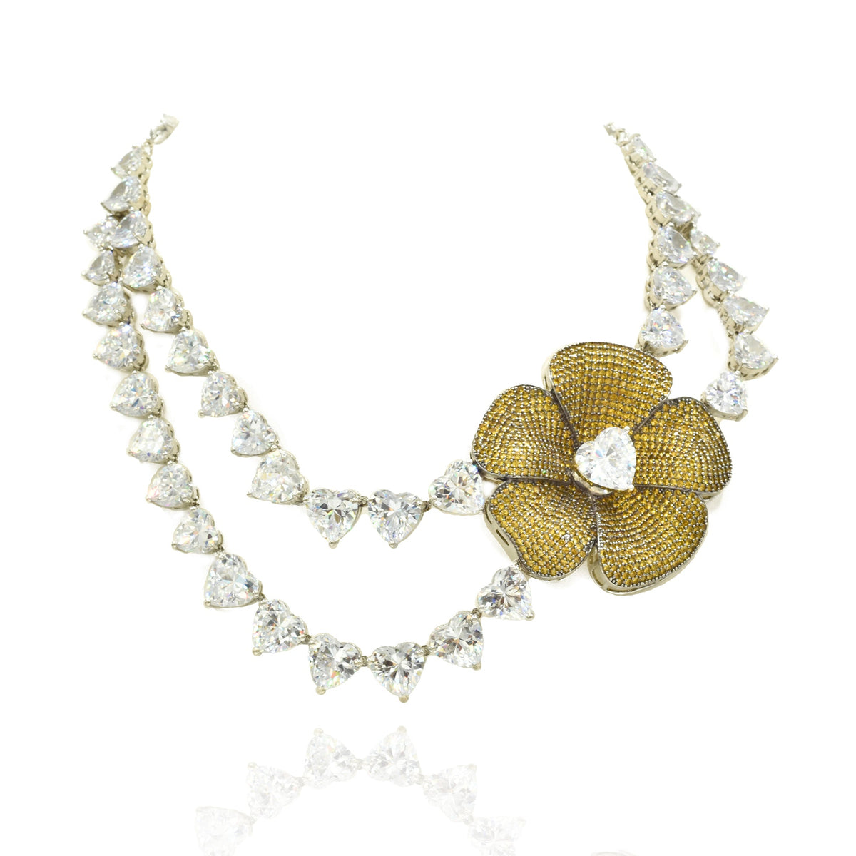 Double-layer American Diamond necklace with heart-shaped clear stones, oversized gold-tone floral centerpiece and matching statement flower earrings.