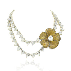 Double-layer American Diamond necklace with heart-shaped clear stones, oversized gold-tone floral centerpiece and matching statement flower earrings.