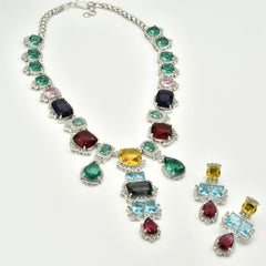 Multicolor statement necklace set with green, blue, pink, yellow, aqua, and wine stones in a silver-tone setting with matching drop earrings.